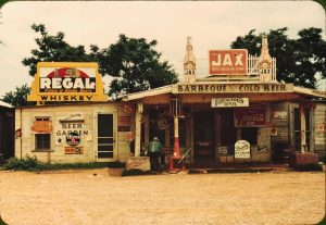 Image of a cross roads store, bar, juke joint, and gas station in the cotton plantation area, Melrose, Louisiana, June 1940.