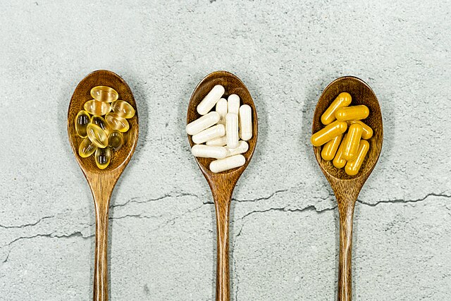 Wooden spoons containing supplements with natural ingredients
