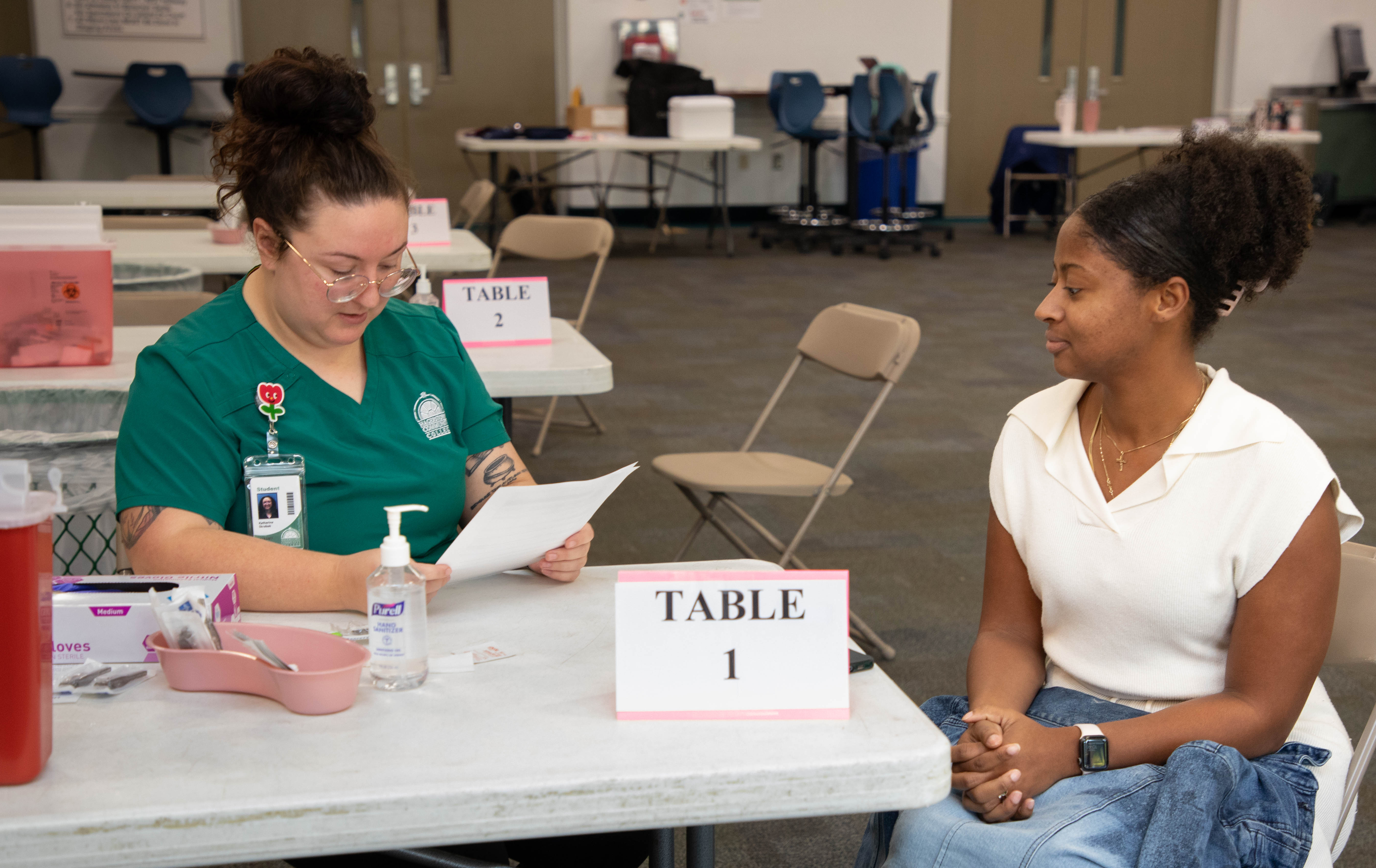 Nursing completing intake from at flu clinic
