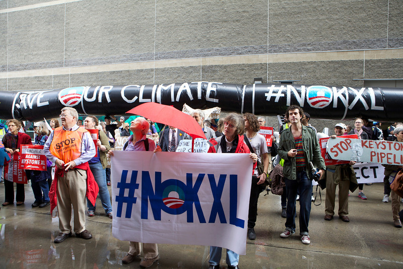 "People Risk Arrest at State Department Office in Boston Protesting Keystone XL Pipeline " by Kayana Szymczak, CC BY 2.0